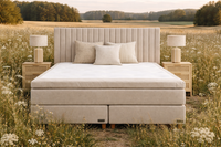 Handcrafted Swedish continental bed in natural linen fabric styled in a calm Scandinavian countryside setting with soft neutral