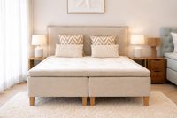 Swedish handcrafted boxspring bed with upholstered headboard, natural fabrics and Scandinavian bedroom styling in a premium Mall