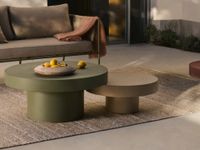 Contemporary outdoor coffee tables in cement on Mediterranean terrace