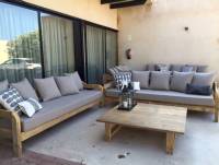 Outdoor lounge sofa set on modern Mediterranean villa terrace