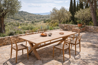 Handcrafted teak outdoor dining table and chairs on Mediterranean terrace