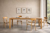 custom oak dining table in mediterranean villa interior in mallorca with natural light