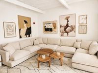 Bright modern living room with a large beige sectional sofa in a Santa Catalina townhouse, interior design by LifestyleMALLORCA. Bright modern living room with a large beige sectional sofa in a Santa Catalina townhouse, interior design by LifestyleMALLORCA.